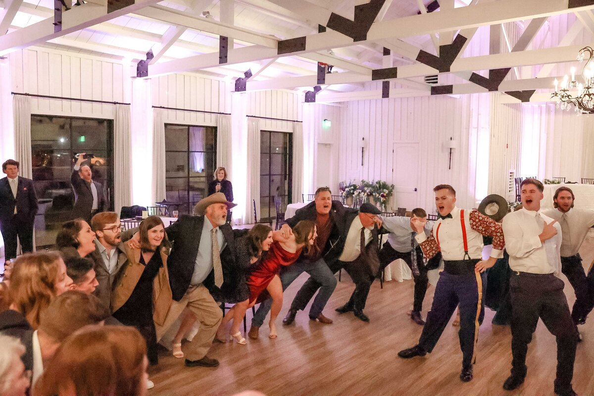 Aggie war hymn at Texas wedding guests sway arm in arm