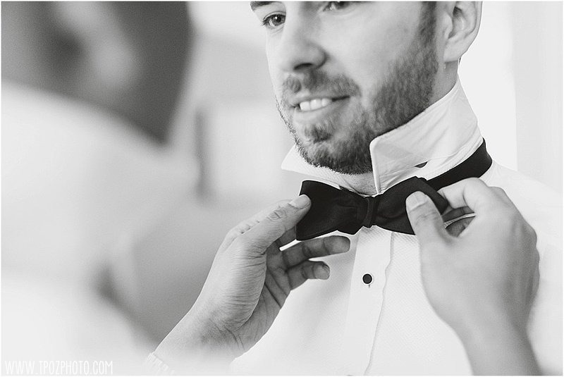 gay couple tying a bowtie