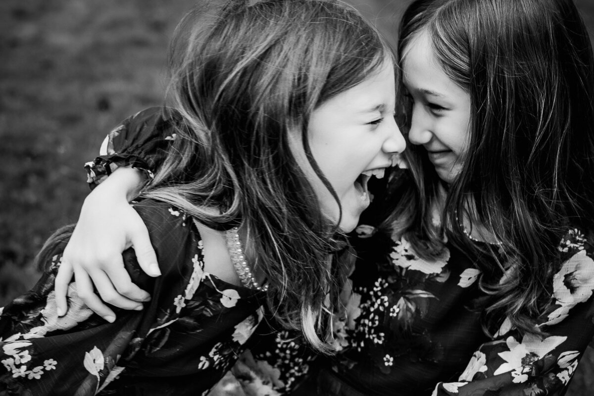 sisters laughing during long island family photo session