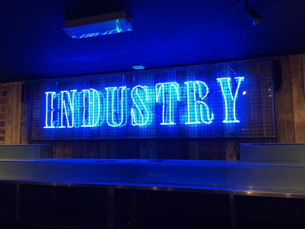 Caged Industry Neon Sign