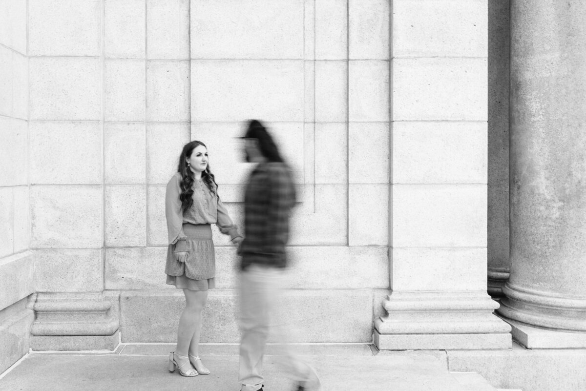 Boy is blurred and girl is in focus while walking
