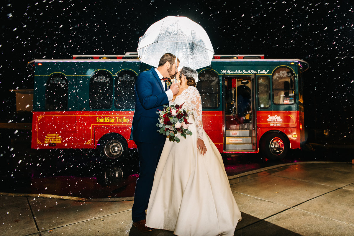 Couple kissing in the rain -Augusta, GA Wedding Photographer