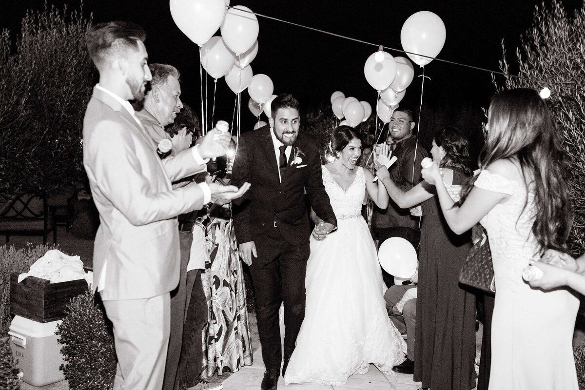 bride and groom leaving reception