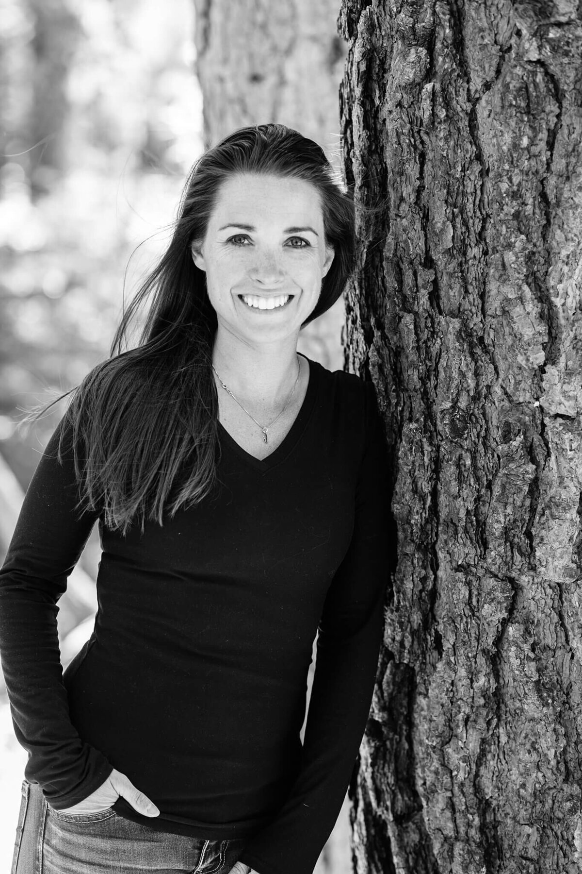headshot of young woman real estate casual black and white image