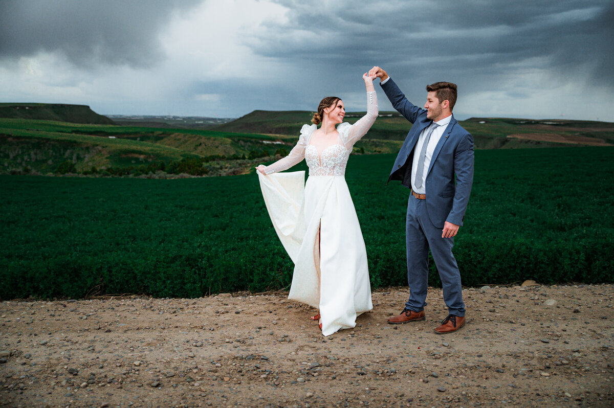Jackson Hole photographers capture golden hour portraits of groom spinning bride