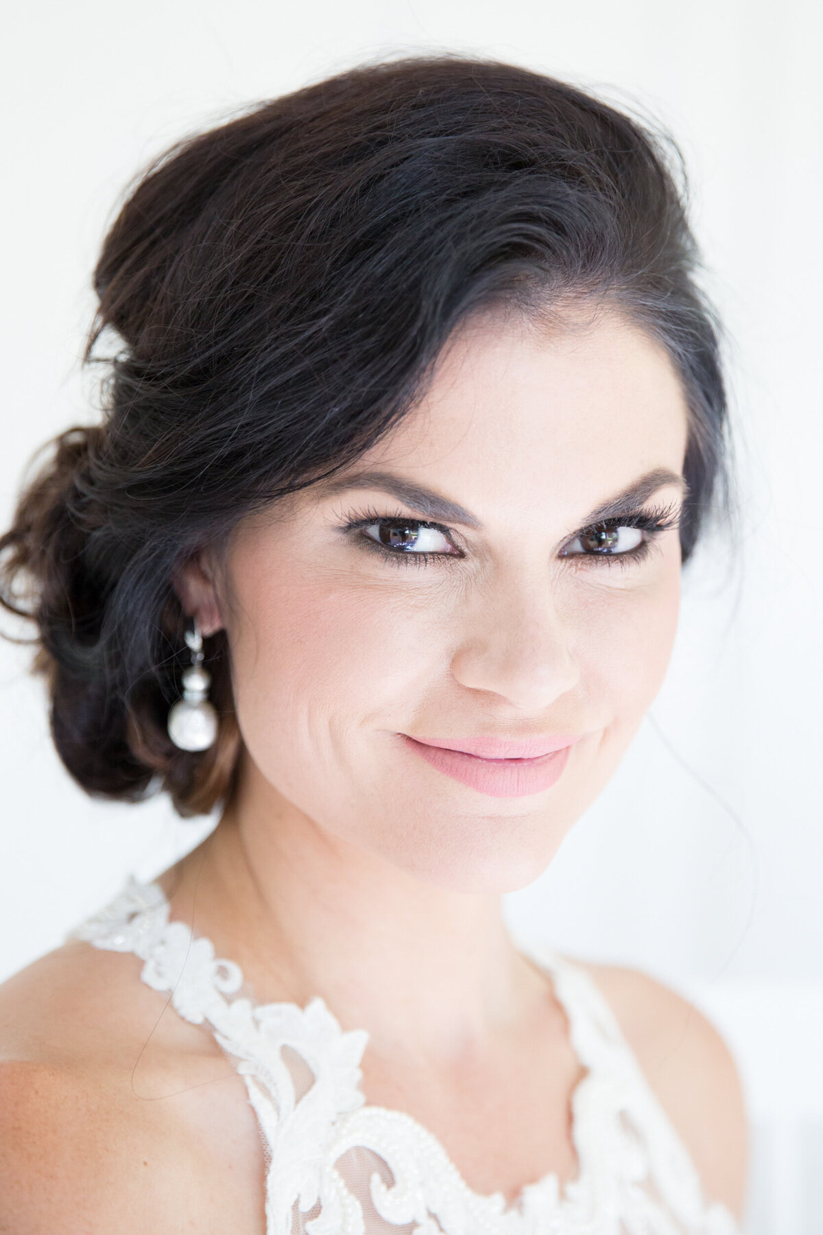 portrait of a bride  smiling at the camera. Portrait photographer in Raleigh.