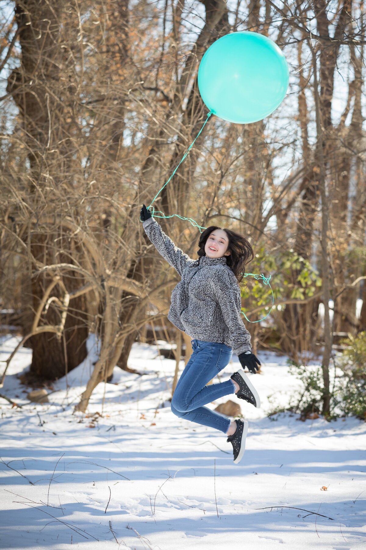 bat-mitzvah-preshoot-girl-jumping-holding-balloon