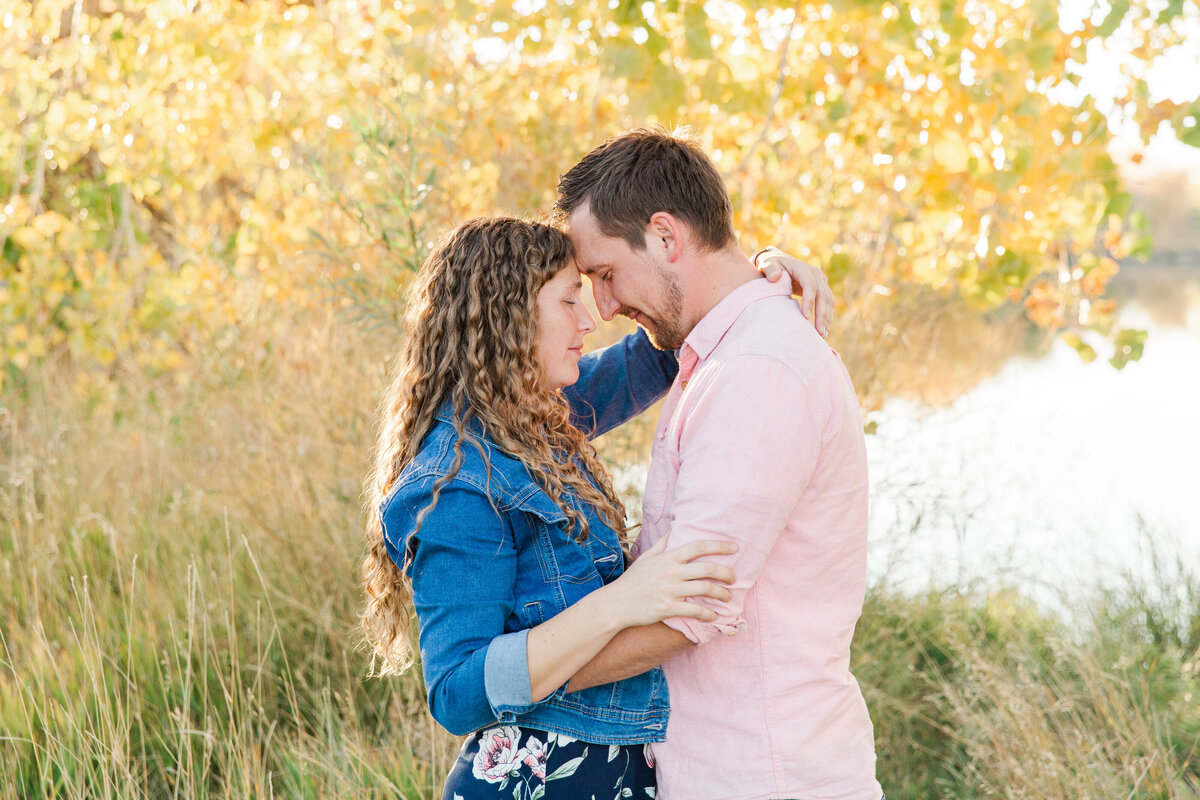 Husband and wife forehead to forehead at Golden Ponds, Longmont, CO