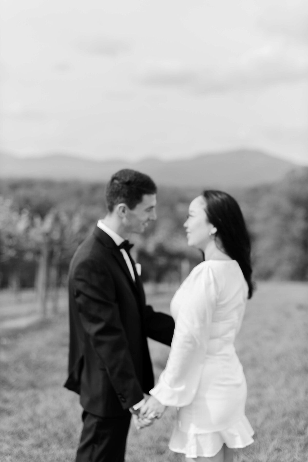 A bride and groom share a moment at Kaya Vineyards.