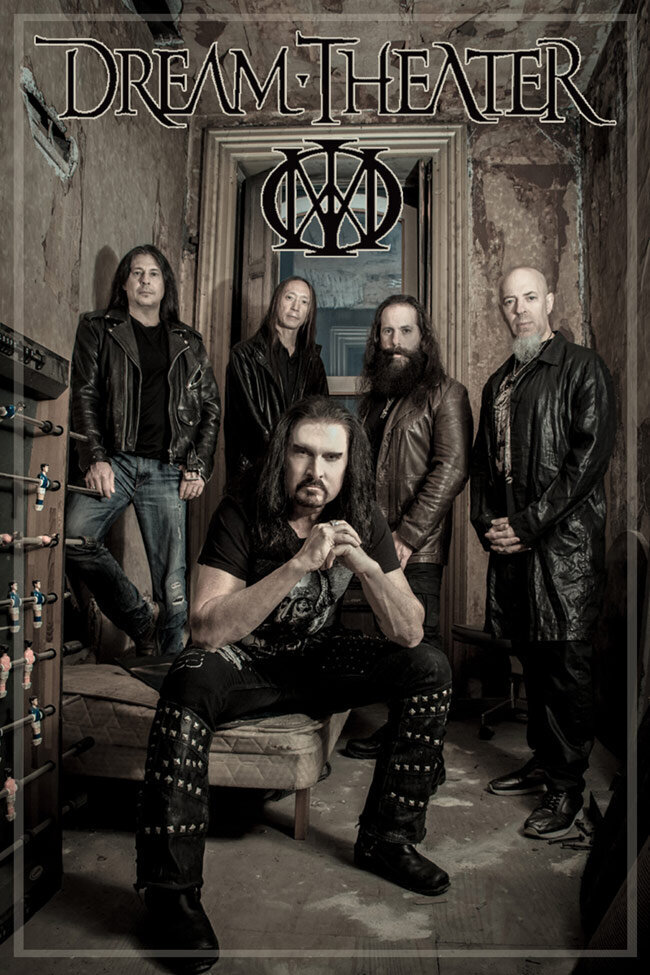 Dream Theater band poster four members standing in small room lead singer sitting in chair in foreground with hands clasped togetehr elbows resting on knees
