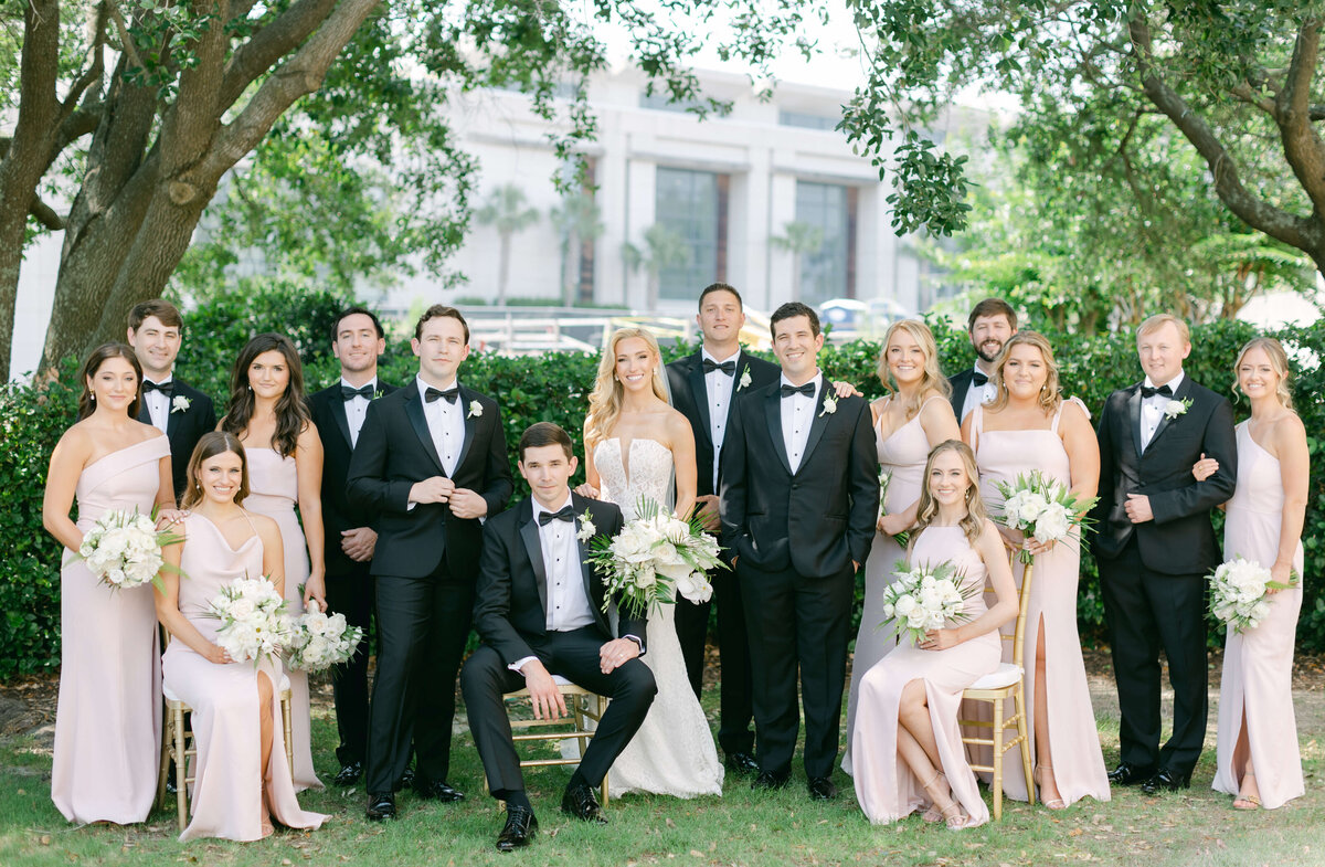 A wedding party sits in the courtyard of Westin Savannah.