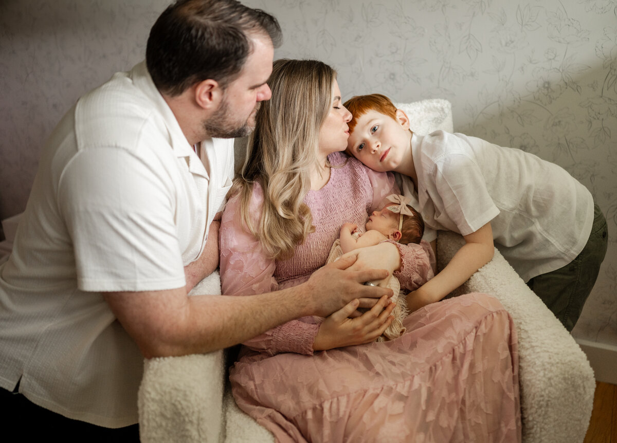 family of four, mom, dad, baby and brother