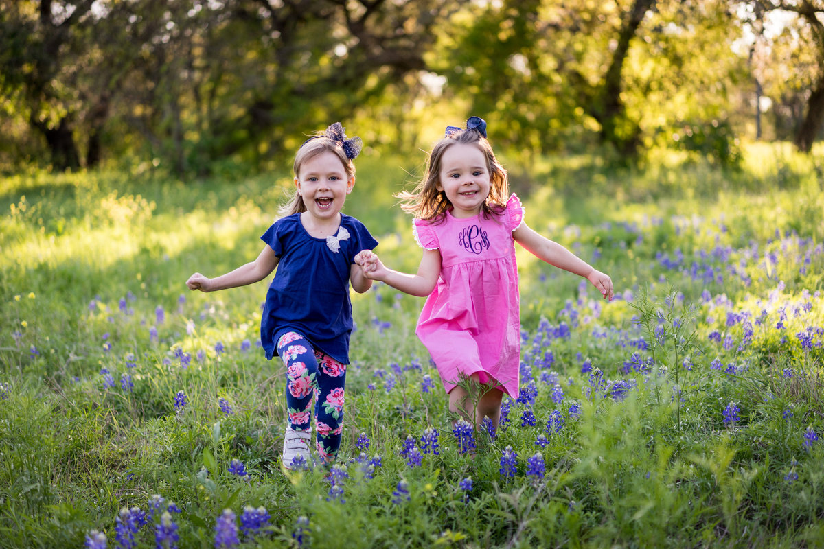 bluebonnet picture of toddler children running during family portrait session in San Antonio by photographer Expose The Heart
