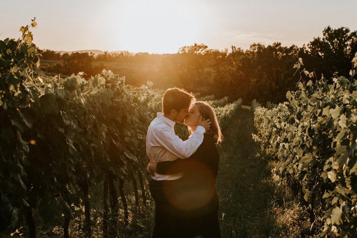 Couple kissing in vineyard in Italy, Montepulciano