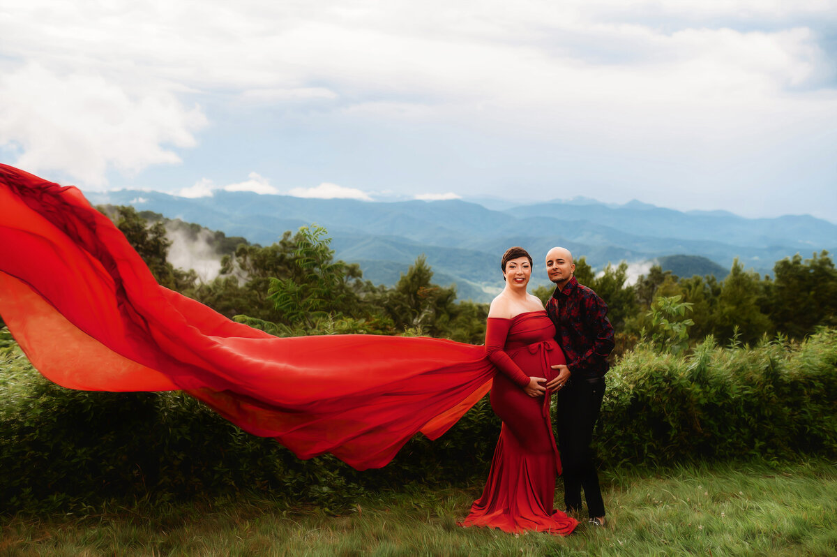 Expectant parents pose for Maternity Photos on the Blue Ridge Parkway in Asheville, NC.