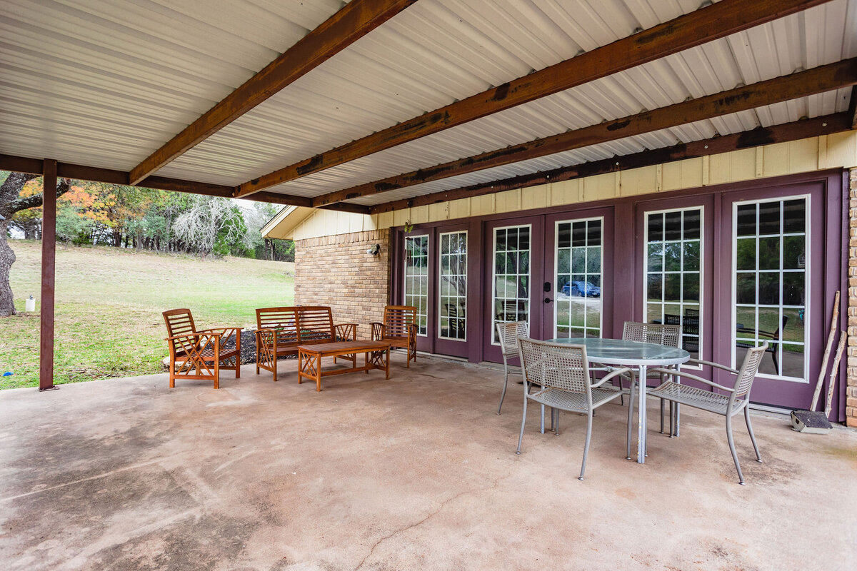 Outdoor patio area with plenty of seating at this three-bedroom, two-bathroom ranch house for 7 with incredible hiking, wildlife and views.