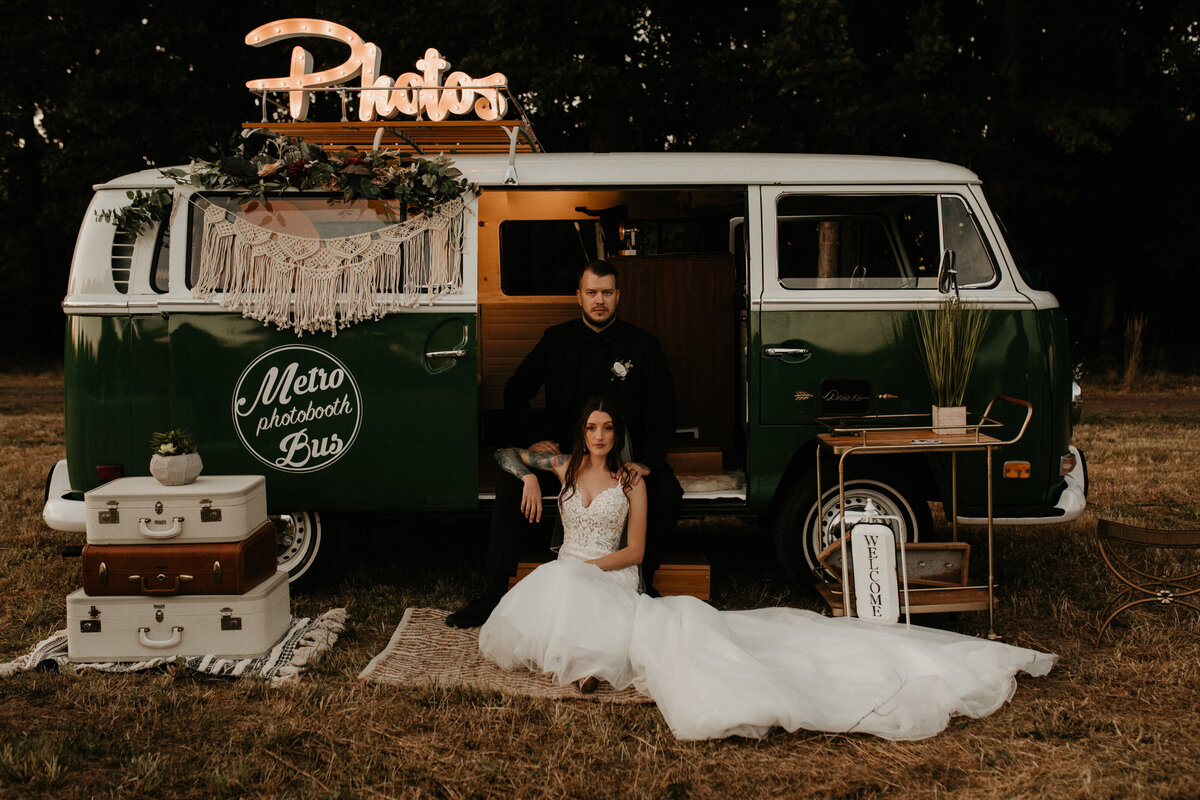 Wedding couple seated on a VW van photo setting