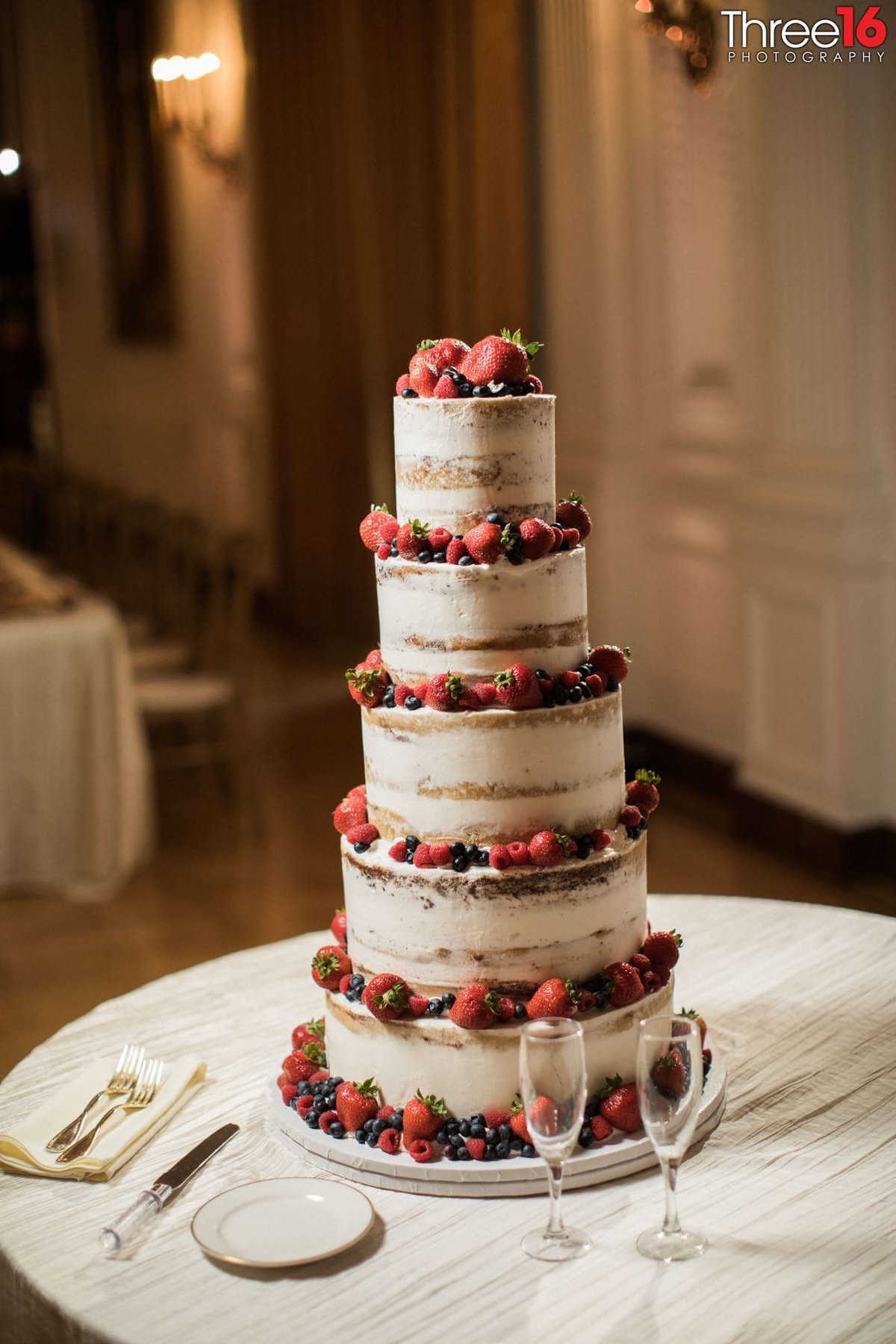 Amazing 5-tiered berry laced naked wedding cake