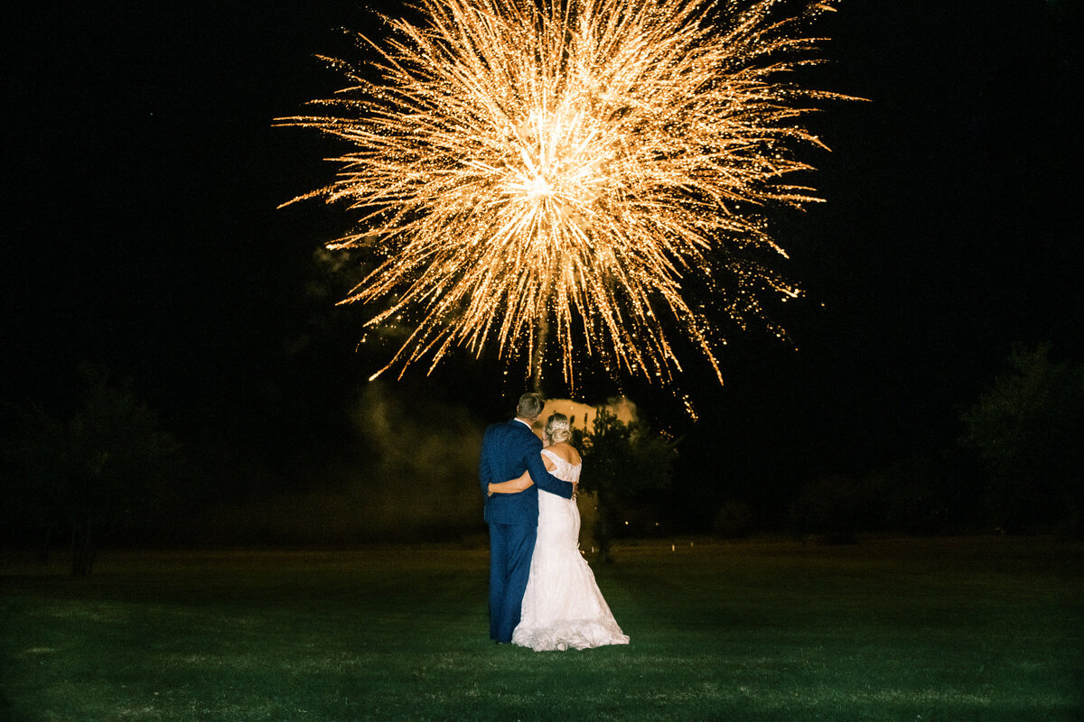 Bride and groom celebrate their marriage with large fireworks at North Texas wedding