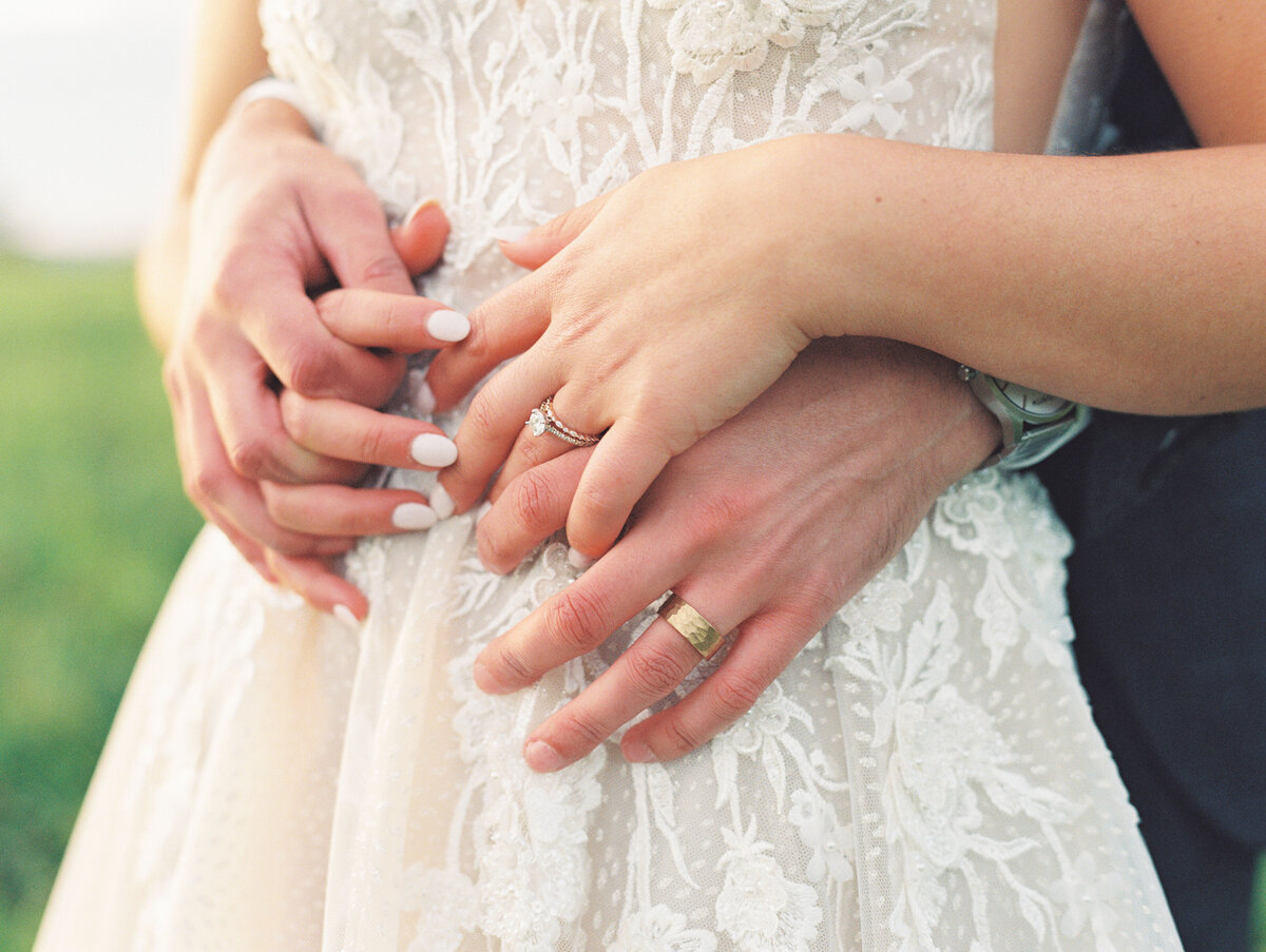 bride and groom holding hands at East Burke wedding, vermont