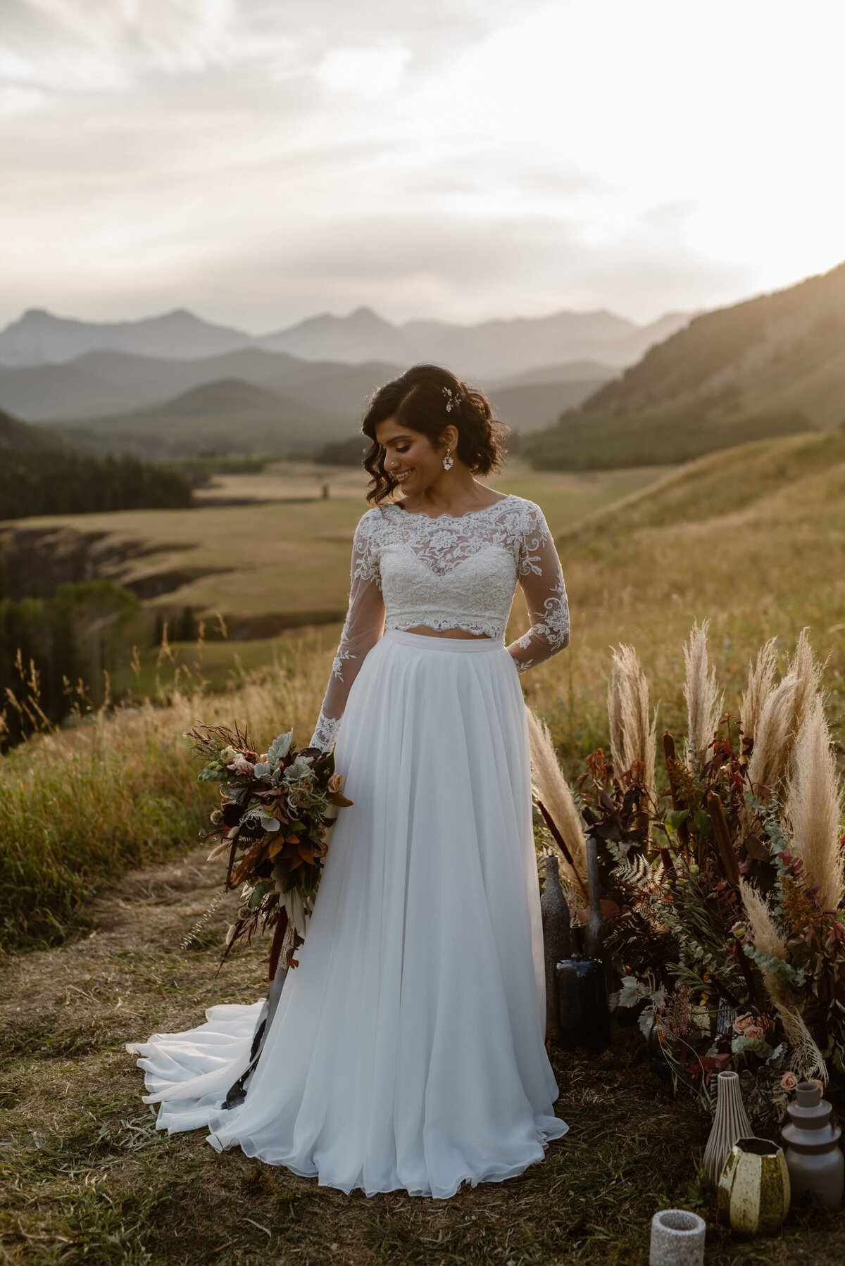 Stunning two piece lace bridal gown from Cameo & Cufflinks, a contemporary bridal boutique based in Calgary, Alberta. Featured on the Brontë Bride Vendor Guide.
