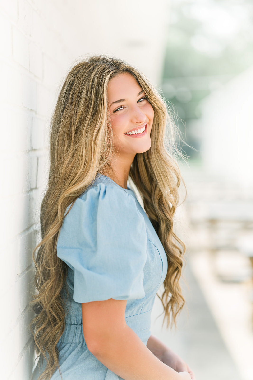 Beautiful Denham Springs senior laughs during photo session with Morgan Leigh Photography.