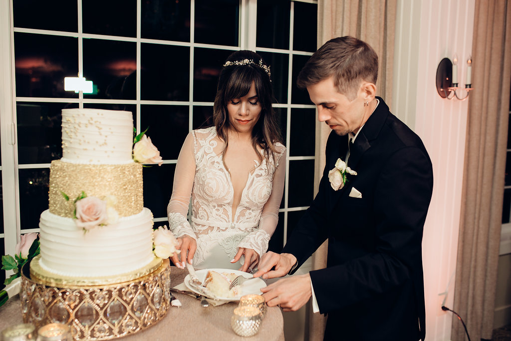 Wedding Photograph Of Groom Taking a Piece Of The Cake Los Angeles