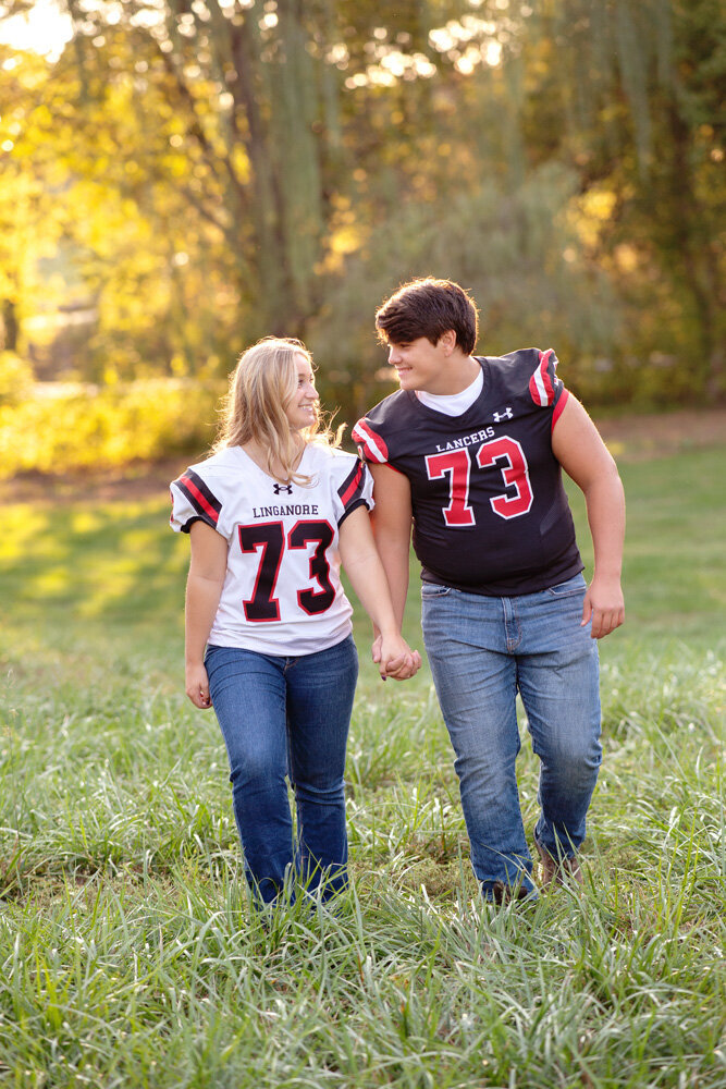 Senior session of couple wearing jerseys