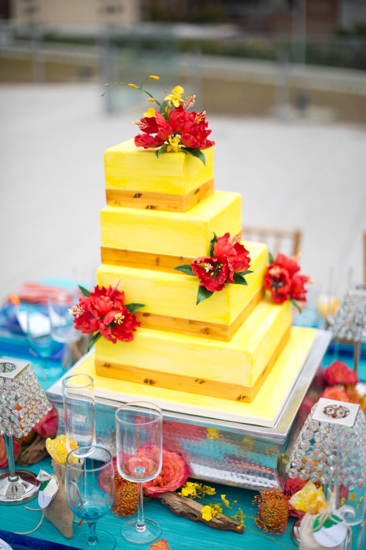 four tier box cake in yellow with minimal floral details
