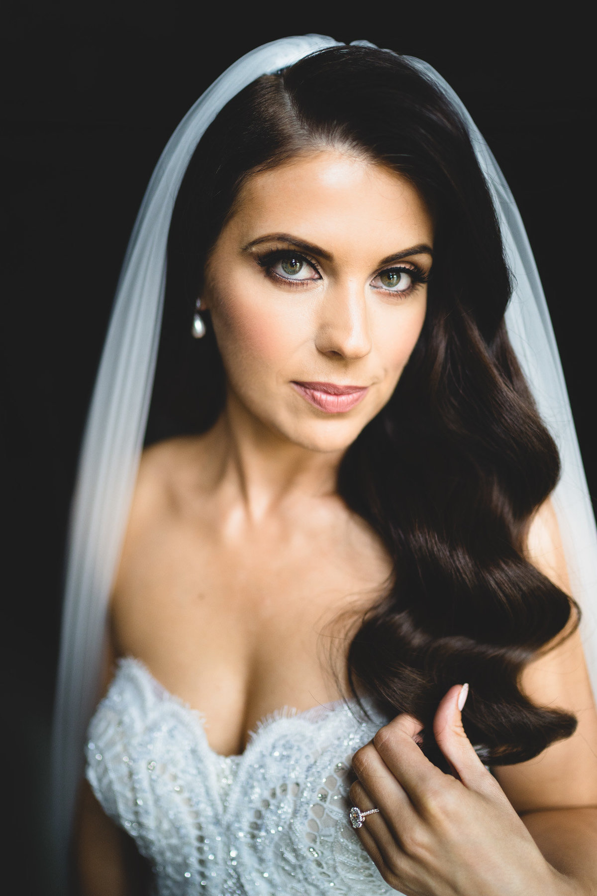 elegant bride in a berta wedding dress looking into camera