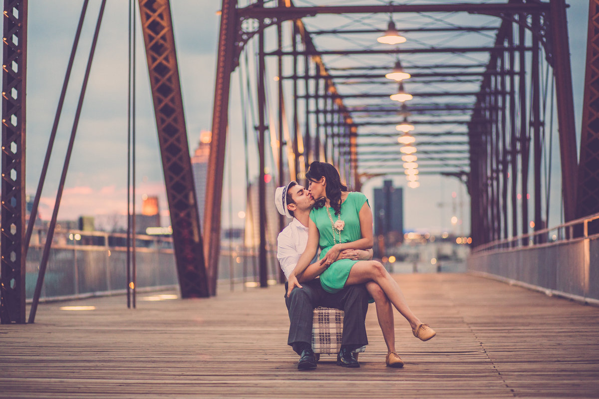 Famous image of engaged couple kissing on Hays Street Bridge in San Antonio. Best engagement session on Hays Street Bridge.