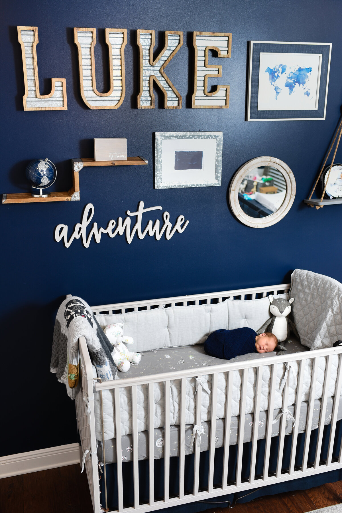 Beautiful lifestyle newborn photography: Newborn boy in his crib in his Star Wars nursery in Pass Christian, Mississippi