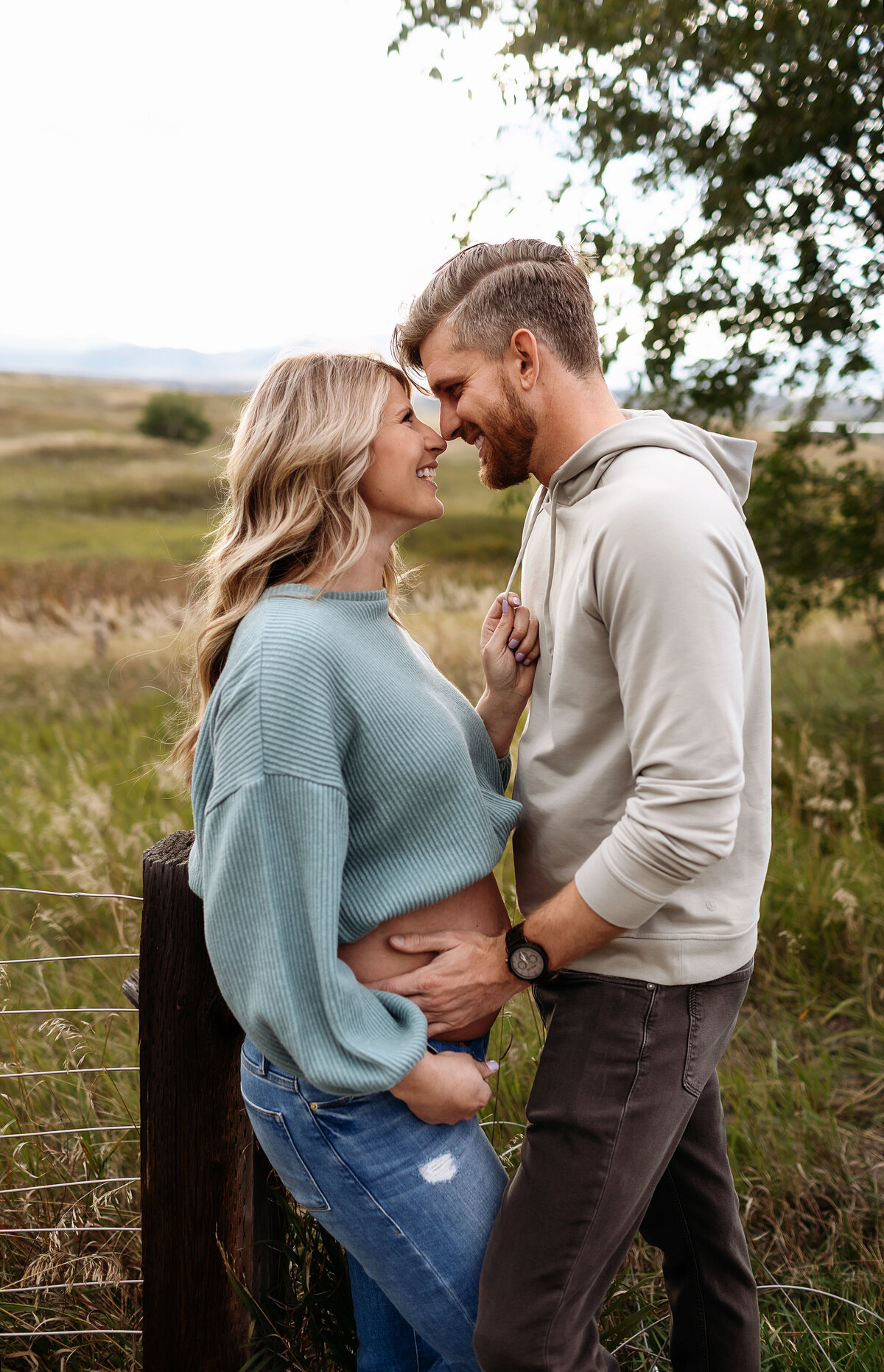 fall maternity photos in broomfield colorado with gorgeous couple