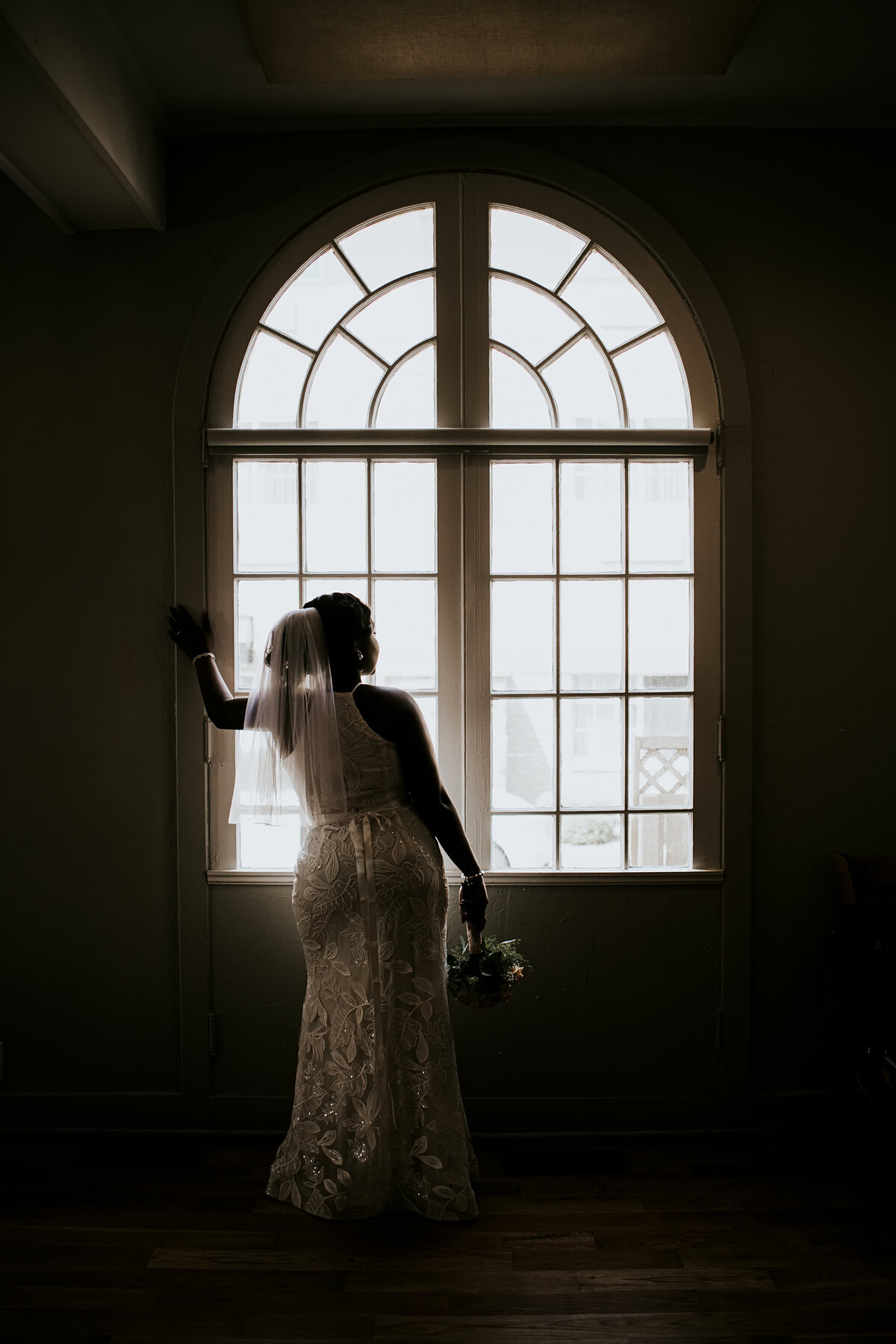 black bride in window silhouette