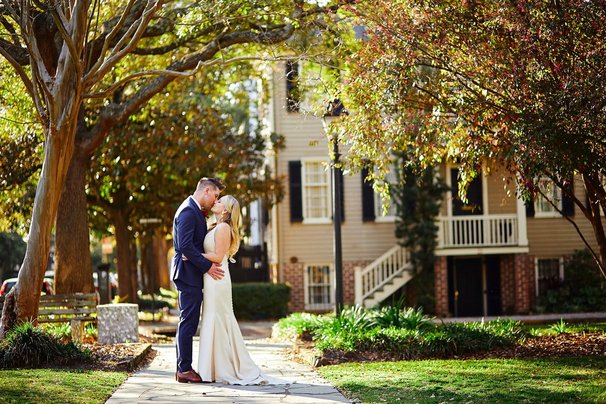 Bride and groom kiss in Downtown Savannah wedding