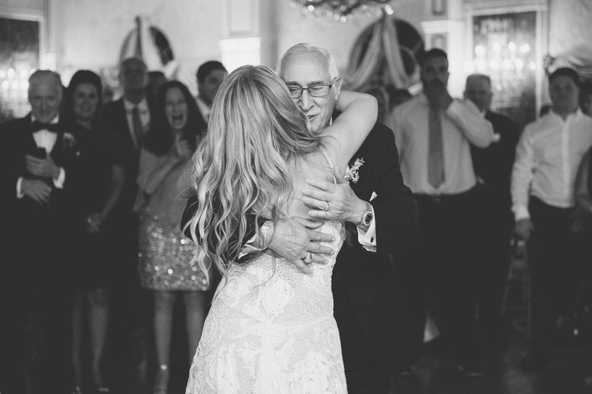 black and white photo of bride dancing with dad at Giorgios Baiting Hollow