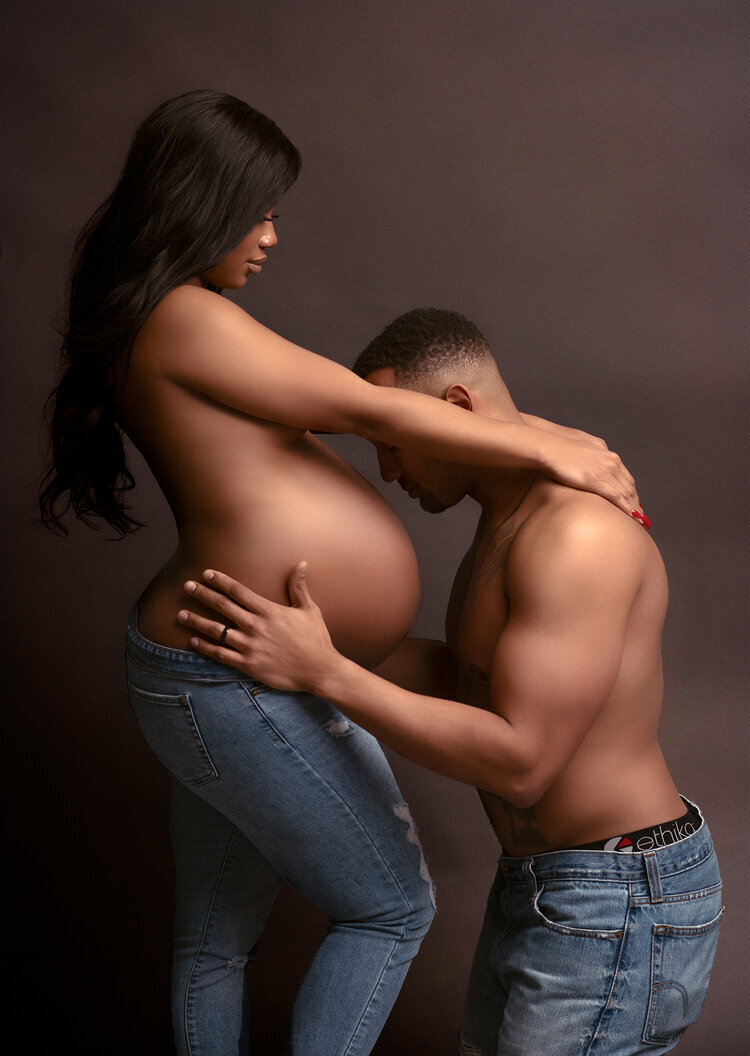 Husband Kissing Pregnant Wife's Belly