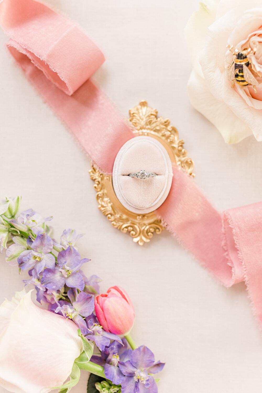 ring photo with pink ribbon, bridgerton themed