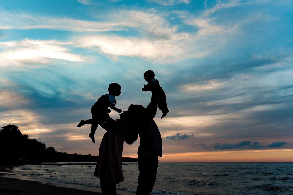 Silhouette of family at sunset