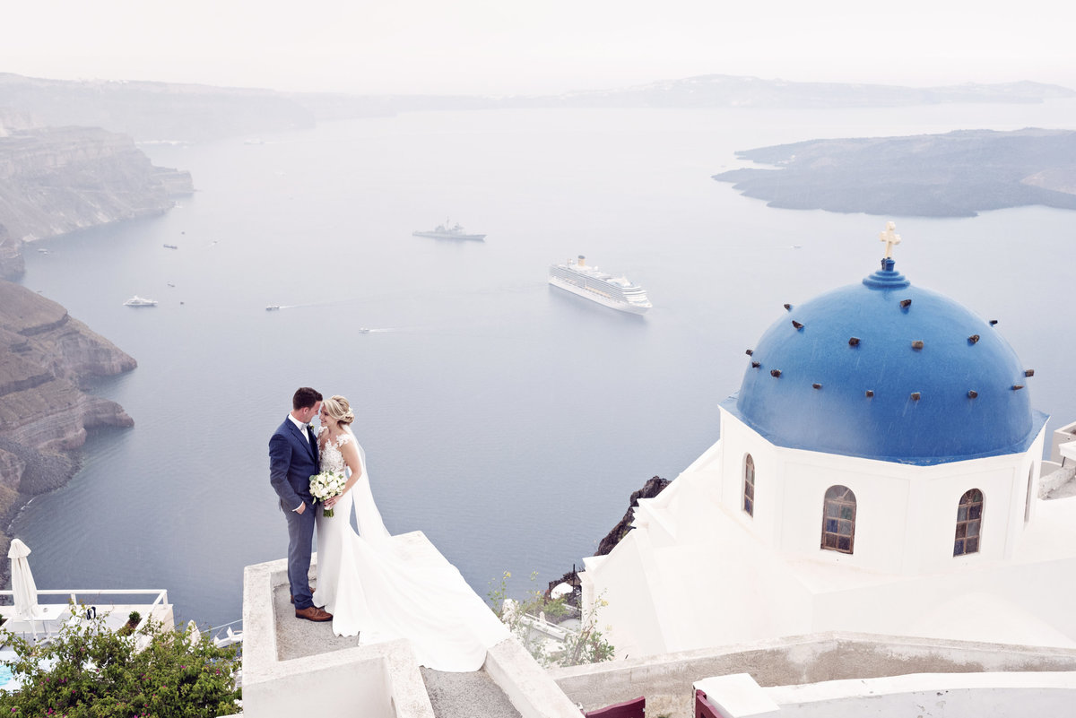 Bride and Groom in Santorini at the blue domes