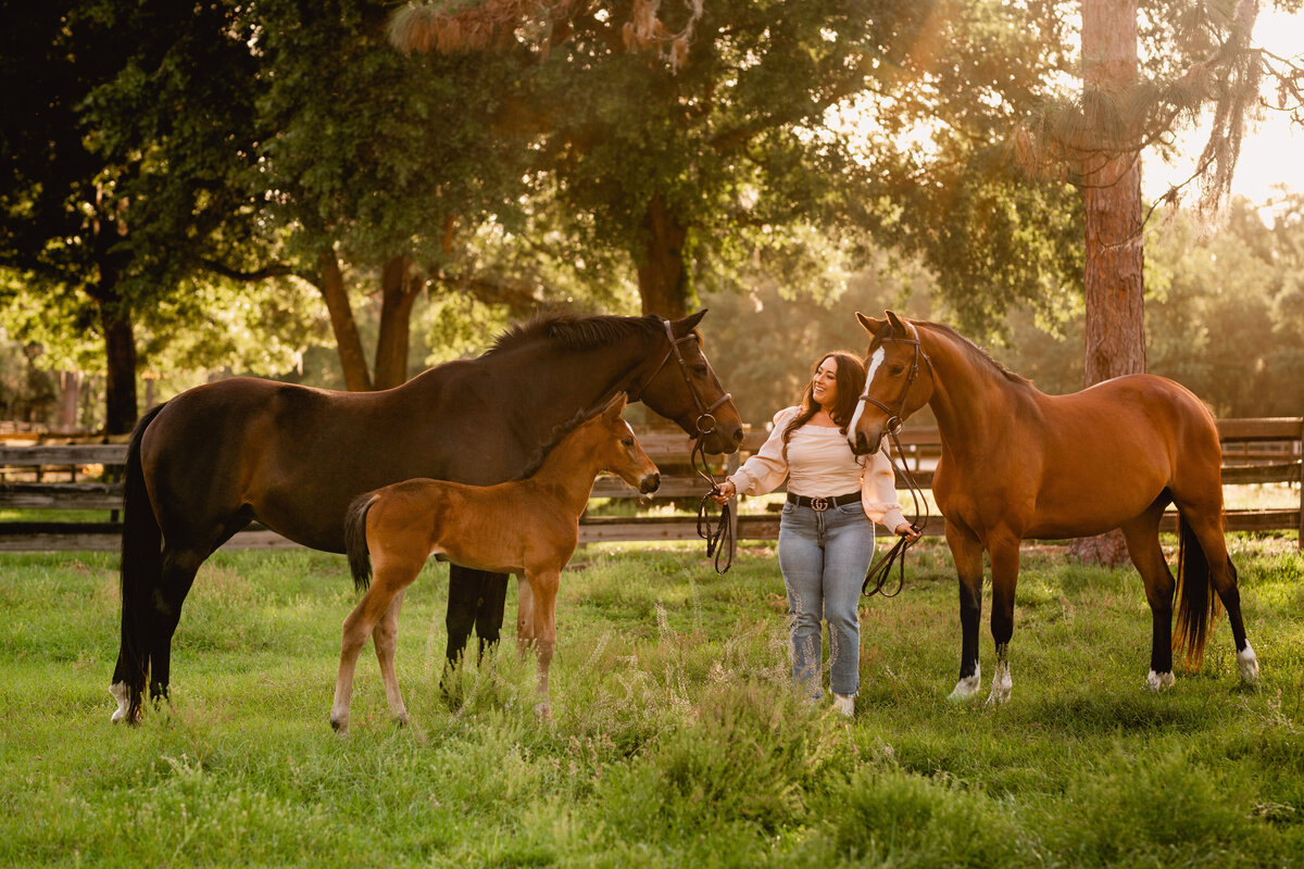 Cute horse and rider portrait session with woman and her mare and foal at Prosperity farms near Ocala, Florida.