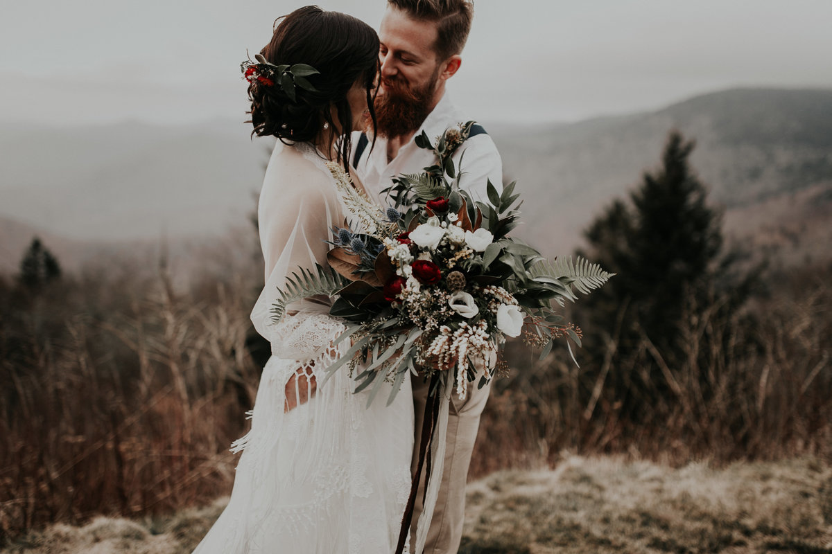 Bride and Groom snuggled up on the Blue Ridge Parkway
