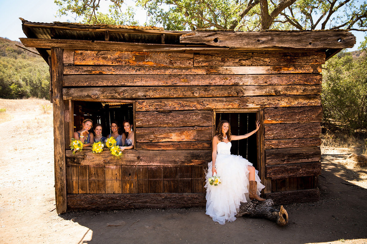 Destination wedding photos bridal party rustic barn