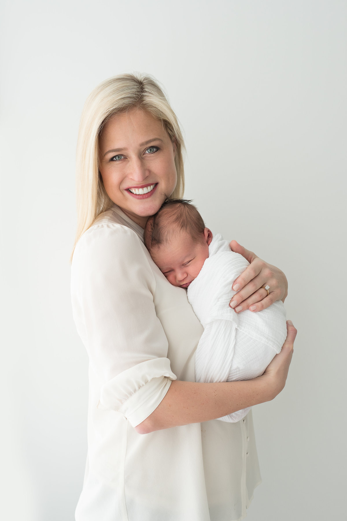 a new mom holds her sweet new baby boy