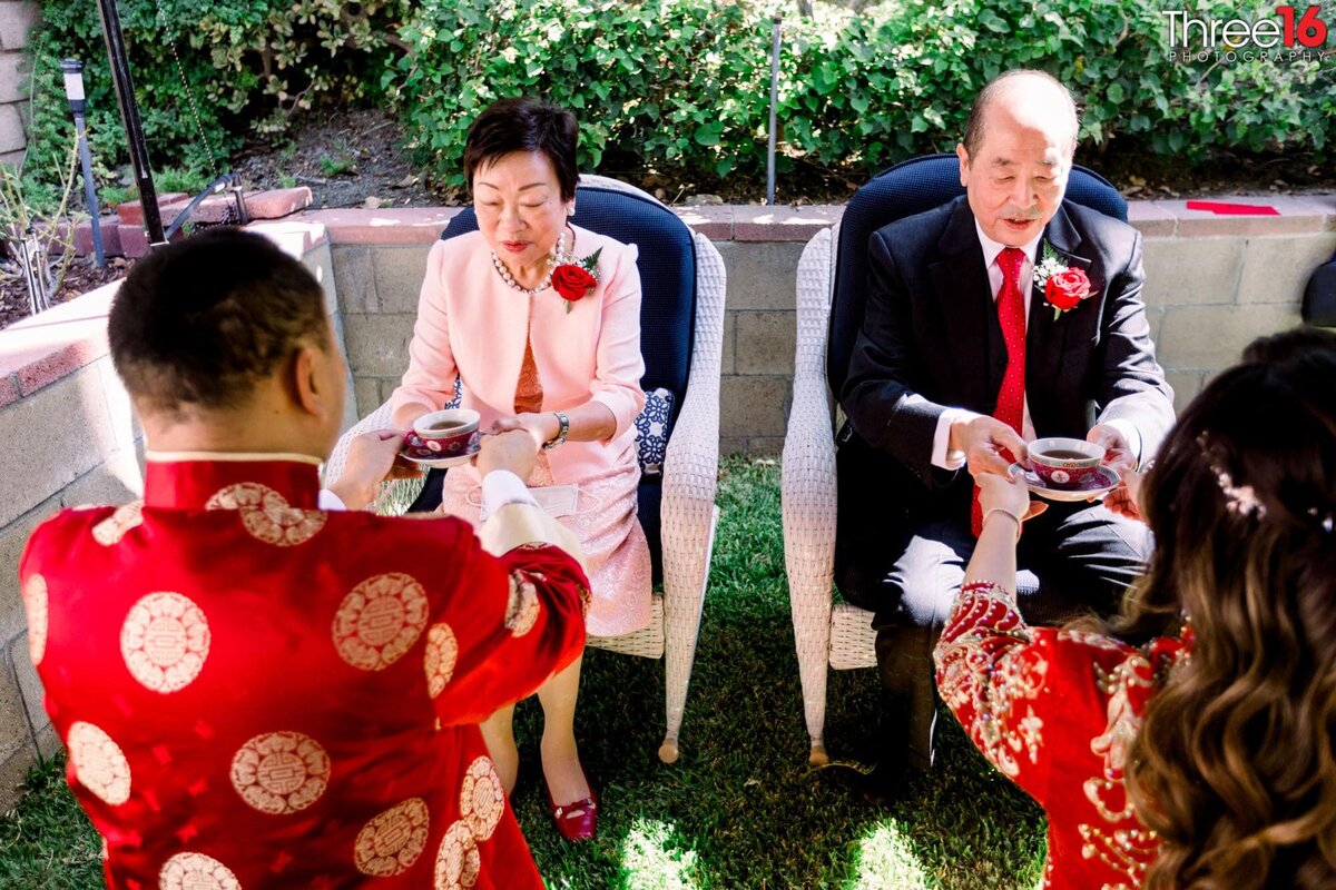 Bride and Groom present parents traditional Chinese Wedding Tea