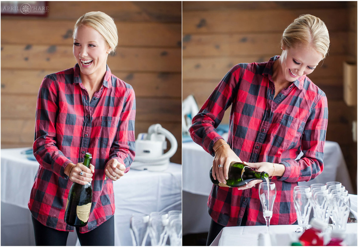 Bride in a cute red plaid shirt pops the champagne prior to getting into her gown in Steamboat Springs Colorado