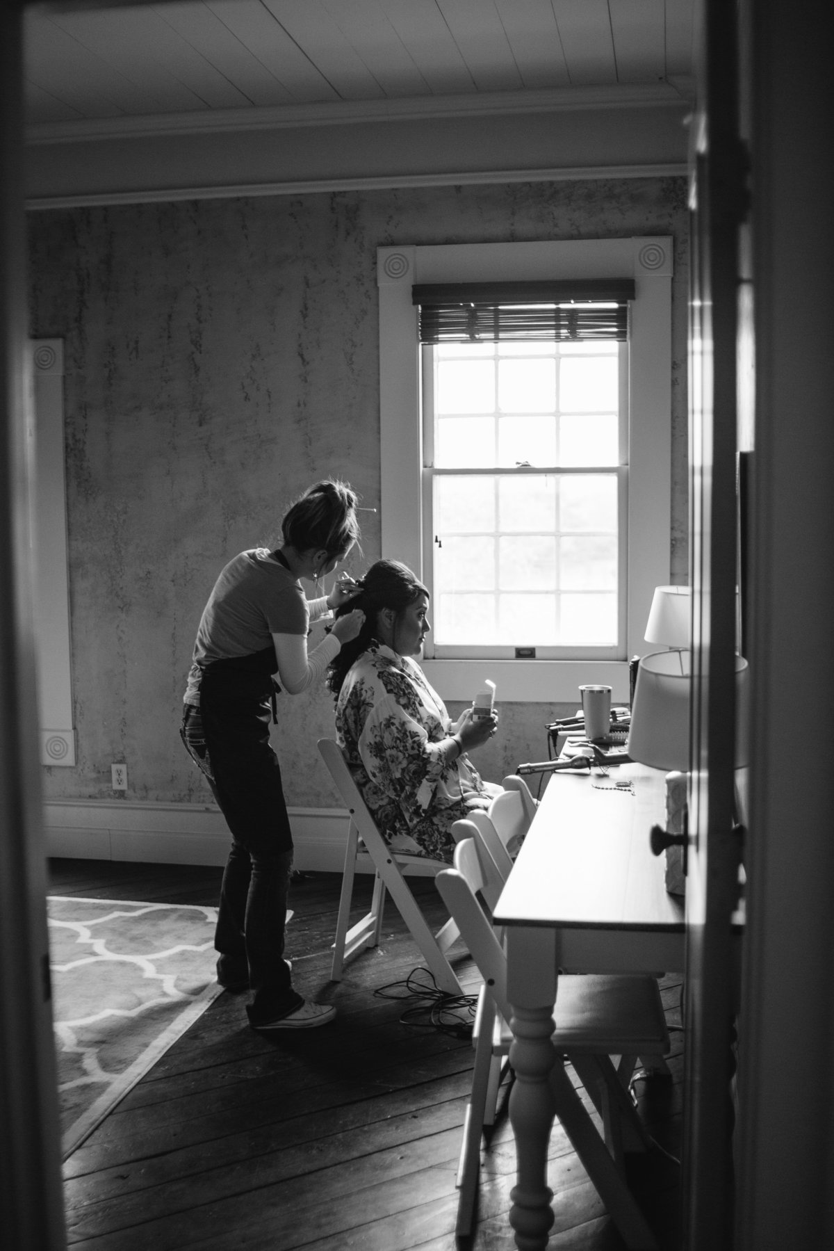 Bride getting hair and make up ready before wedding ceremony at Grande Hall at Hoffman Ranch Texas Hill Country venue