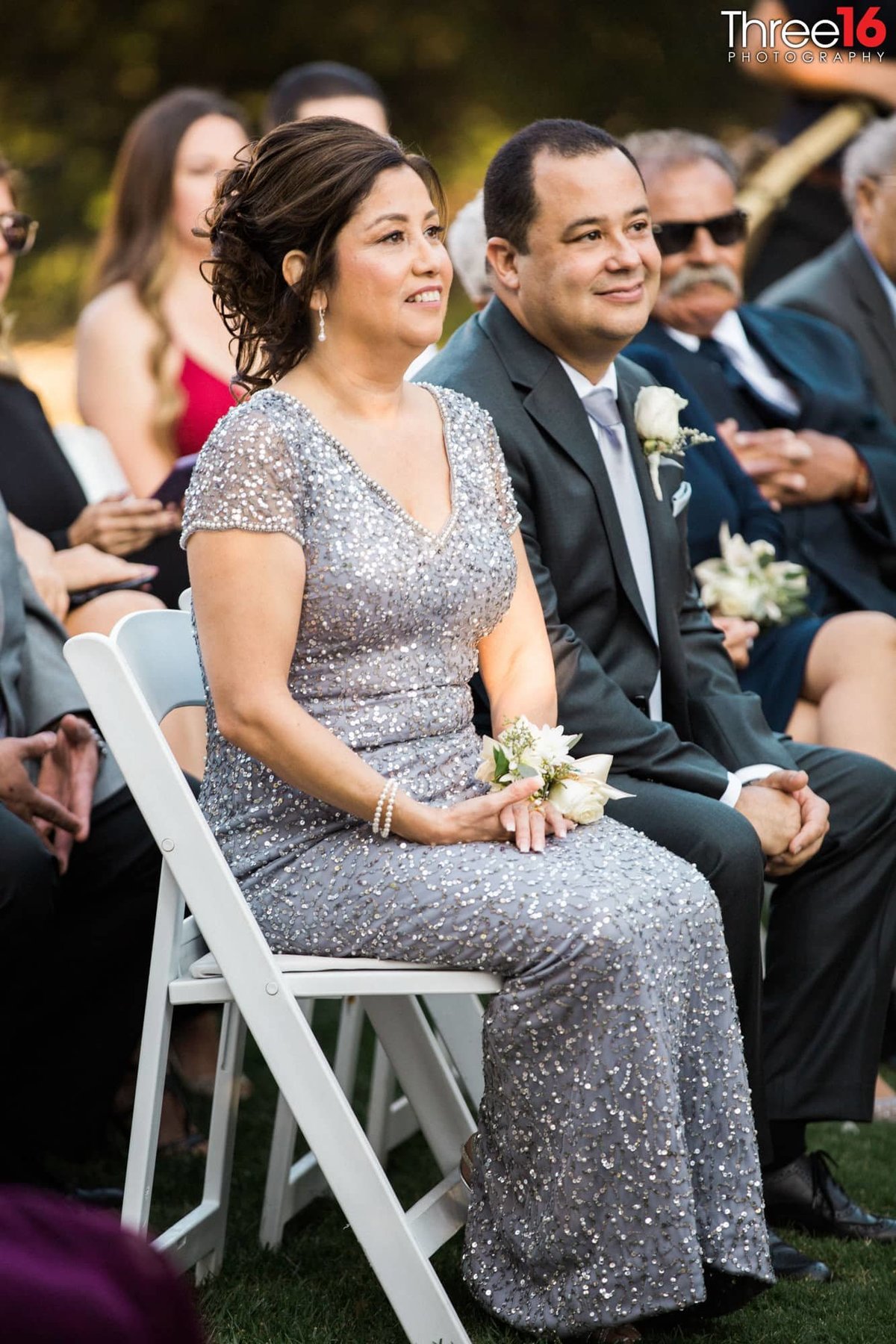 Parents of the Bride watch their daughter get married