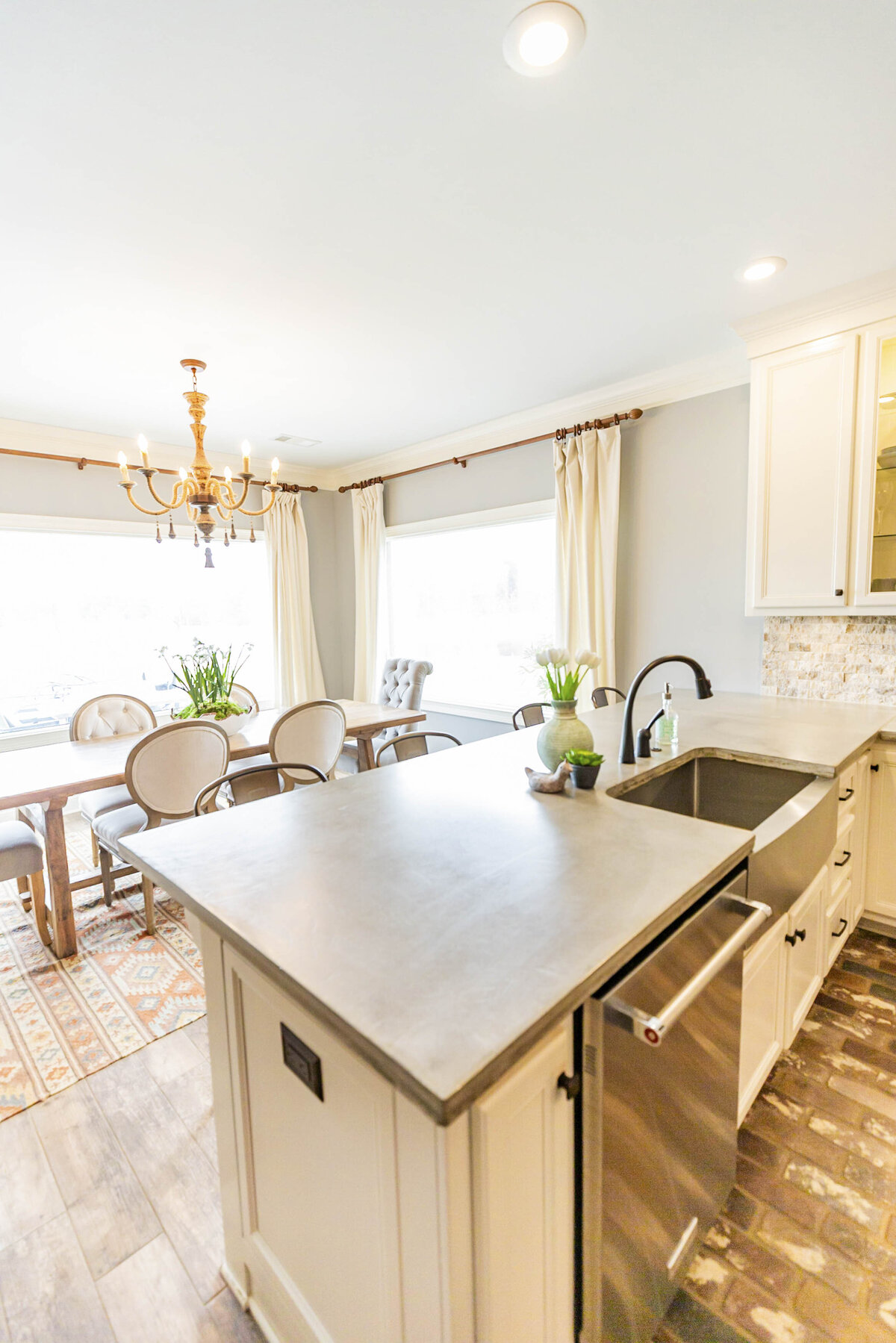 beautiful-kitchen-renovation-white-cabinets-grey-counters-brick-floors2