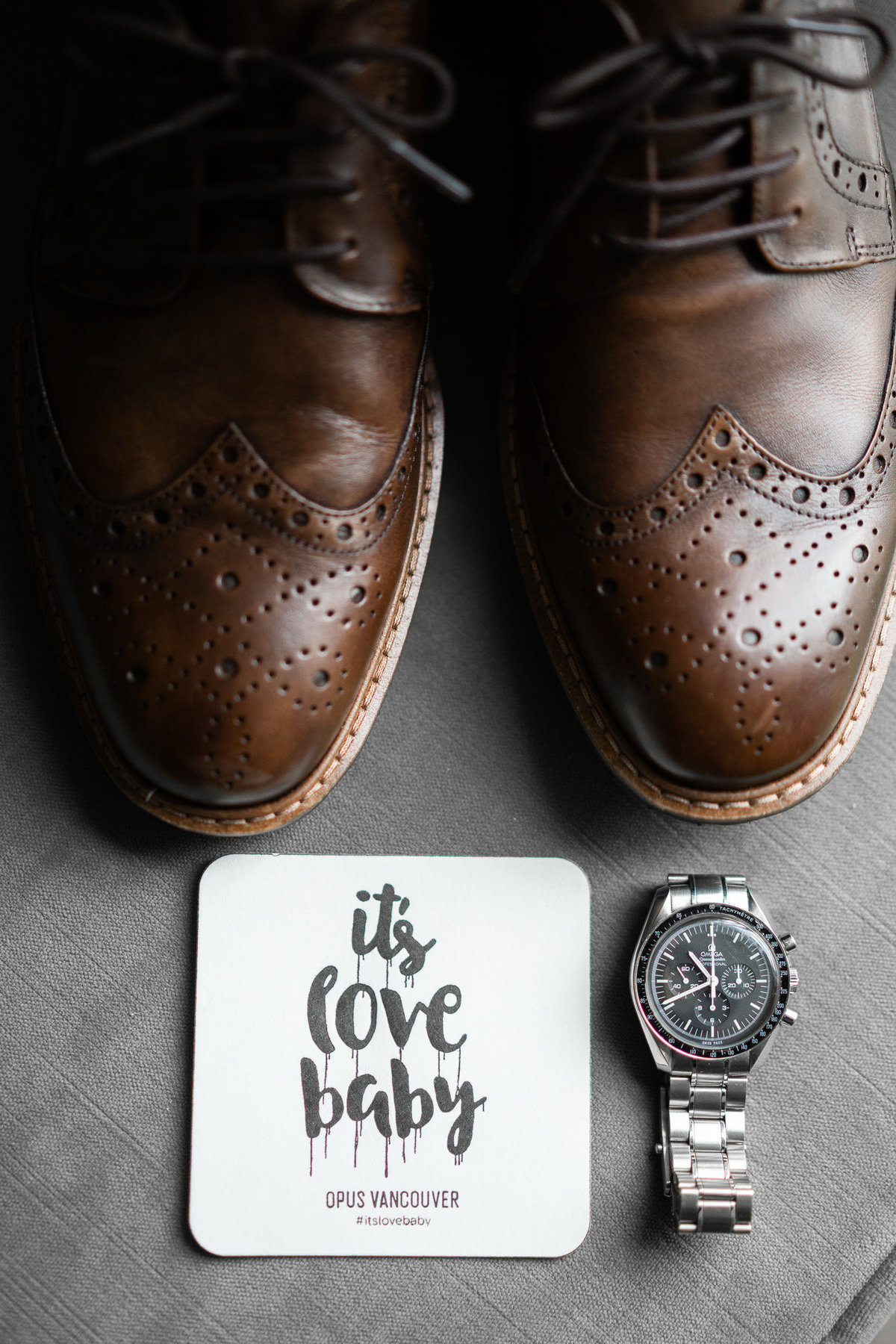 detail photo of grooms watch and shoes at Opus Hotel
